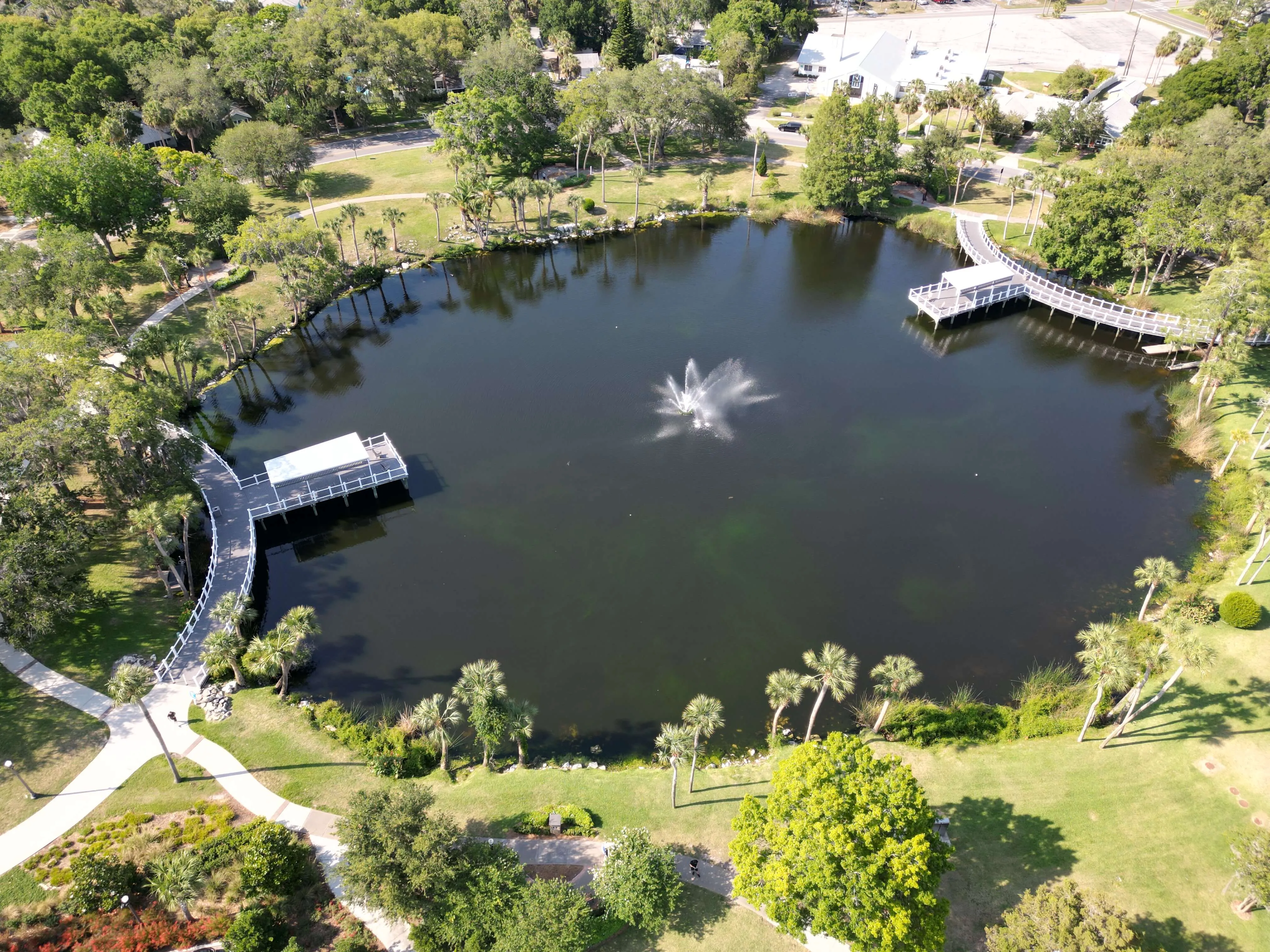 Aerial view of waterfront dining area at The Commons on Grand overlooking Orange Lake